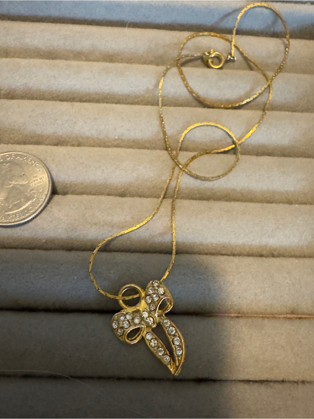 Gold Bow Pendant Necklace with Crystal Accents